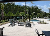 Thumbnail 7 of 16 - Outdoor Lounge Area at Avilla Silver Palm, Land O Lakes, FL 34638