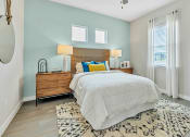 Thumbnail 11 of 14 - a bedroom with a bed and two windows at Avilla Towne Center Apartments, Texas, 75407