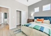 Thumbnail 9 of 14 - a bedroom with a bed and a closet at Avilla Towne Center Apartments, Texas