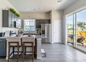 Thumbnail 2 of 9 - Gourmet Kitchen with Island at Avilla Mesa Vista, Golden, CO 80403