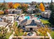 Thumbnail 9 of 32 - a aerial view of a neighborhood with houses and a swimming pool