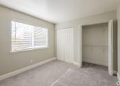 Thumbnail 29 of 32 - an empty room with a window and a closet