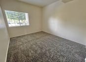 Thumbnail 22 of 41 - Carpeted Bedroom at Sharlands Terrace Apartments, Reno, NV