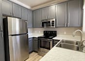 Thumbnail 17 of 41 - Modern Kitchen at Sharlands Terrace Apartments, Reno, Nevada
