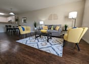 Thumbnail 20 of 31 - a living room with yellow chairs and a rug at Tivoli Apartments of Orlando, Oviedo, Florida, 32765