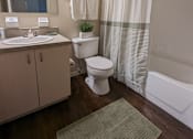 Thumbnail 24 of 31 - a bathroom with a toilet and a sink and a shower at Tivoli Apartments of Orlando, Oviedo, Florida, 32765