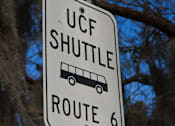 Thumbnail 11 of 31 - a street sign that reads shuttle route 6 and stop 2 at Tivoli Apartments of Orlando, Oviedo, Florida, 32765