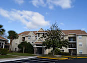 Thumbnail 3 of 31 - an apartment building with a tree in front of it at Tivoli Apartments of Orlando, Oviedo, 32765