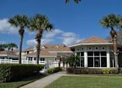 Thumbnail 2 of 31 - a house with palm trees in front of it at Tivoli Apartments of Orlando, Oviedo, Florida