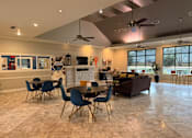 Thumbnail 15 of 37 - A modern dining room with a large table and chairs.