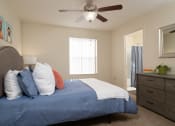 Thumbnail 34 of 39 - a bedroom with a large bed and a ceiling fan at Stoneridge Apartments, Gainesville, 32608
