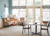 Thumbnail 5 of 5 - Living room with a table and chairs Spring Arbor of Cary