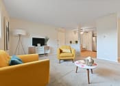 Thumbnail 9 of 28 - a living room with yellow furniture and a white carpet at Aspen Ridge Apartments, West Chicago, Illinois
