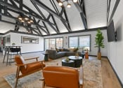 Thumbnail 14 of 28 - a living room with a couch and chairs and a table at Aspen Ridge Apartments, West Chicago, Illinois