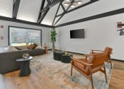 Thumbnail 13 of 28 - a living room with a couch and chairs and a large window at Aspen Ridge Apartments, Illinois, 60185