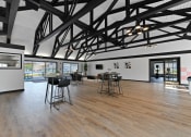 Thumbnail 10 of 28 - a large room with tables and chairs in the middle of it at Aspen Ridge Apartments, West Chicago, Illinois