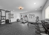 Thumbnail 20 of 35 - Home gym with cardio and weight training equipment at Fox Run Apartments, Illinois, 60174