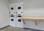 Thumbnail 35 of 35 - a laundry room with washing machines and a bench
