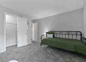 Thumbnail 13 of 35 - an empty bedroom with a bed and a closet