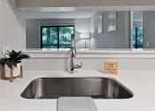 Thumbnail 8 of 35 - a large stainless steel sink in a white kitchen