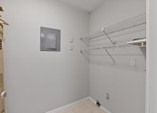 Thumbnail 18 of 35 - a white room with a white closet and a white shelf on the wall