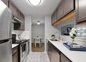 Thumbnail 3 of 35 - an open kitchen with stainless steel appliances and a dining room with a table