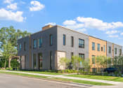 Thumbnail 35 of 45 - a three story building with a street in front of it