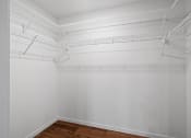 Thumbnail 24 of 36 - room with white walls and a wood floor