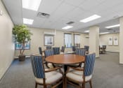Thumbnail 42 of 51 - a conference room with a round table and chairs