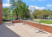 Thumbnail 11 of 55 - a row of bike racks in front of a brick wall