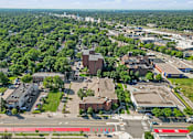 Thumbnail 16 of 25 - an aerial view of a city with buildings and trees