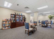 Thumbnail 47 of 51 - a dining room with tables and chairs and a library