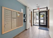 Thumbnail 17 of 52 - the lobby of a building with a locker and a door