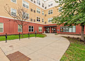 Thumbnail 32 of 35 - a courtyard of a building with a star pattern on the sidewalk