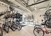 Thumbnail 16 of 17 - A bike shop with many bikes on display.
