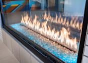 Thumbnail 19 of 26 - a display case of gas flames in a store window