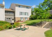 Thumbnail 41 of 57 - a picnic table in front of an apartment building
