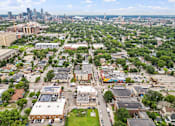 Thumbnail 20 of 35 - an overhead view of an apartment complex with trees