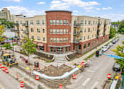 Thumbnail 22 of 35 - a construction site in front of a large brick building