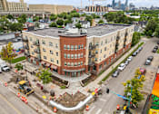 Thumbnail 11 of 35 - an aerial view of a building in the middle of an intersection