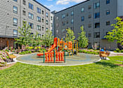 Thumbnail 50 of 53 - a playground in the middle of an apartment complex