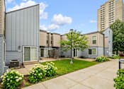Thumbnail 1 of 40 - our apartments have a spacious courtyard with green grass and flowers