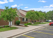 Thumbnail 36 of 43 - a row of houses with trees in front of them on a sidewalk