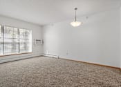 Thumbnail 8 of 27 - view of living room with large windows, hanging ceiling lamp and wall mounted air conditioner