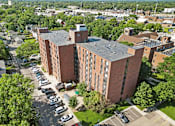 Thumbnail 39 of 55 - an aerial view of a brick building with a gray roof