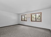 Thumbnail 19 of 43 - the living room of a house with a window and carpet