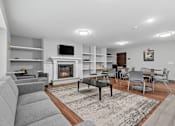 Thumbnail 16 of 40 - a living room with a staircase and a fireplace