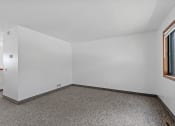 Thumbnail 18 of 43 - a room with white walls and carpet and a window
