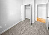 Thumbnail 6 of 24 - an empty room with carpet and a closet