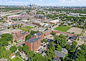 Thumbnail 43 of 55 - an aerial view of the campus with the skyline in the background